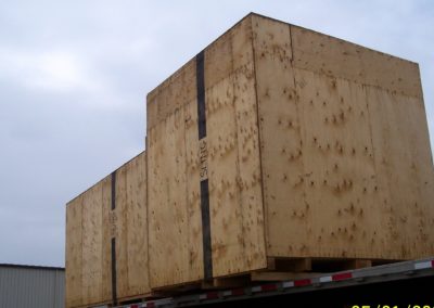 Large custom export crate manufactured by Fox Valley Wood Products on flat bed truck.