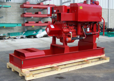 Custom Skid holding red equipment manufactured by Fox Valley Wood Products.